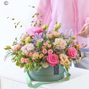 Pastel hatbox flowers with blush roses and mixed blooms